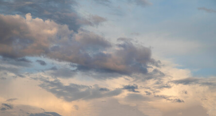 clouds in a stormy sky with a mix of different colors 
