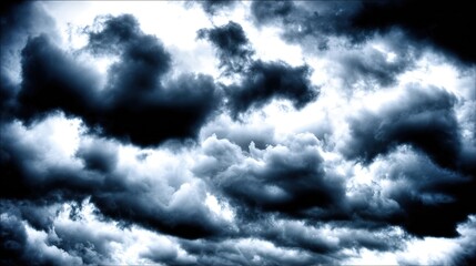 Dramatic storm clouds in deep blue, a sweeping skyscape with dynamic light, nature's raw power on display