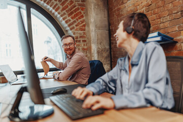 In a modern, hightech workspace, two dedicated professionals are collaborating using cuttingedge...
