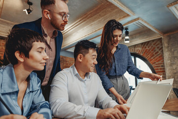 In a uniquely stylish office environment, a diverse team is engaging in collaboration on a project...