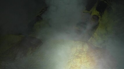 Sulfur plume toxic gas smoke high pressure fire Ijen volcano Indonesia