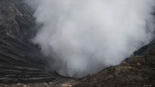 Bromo volcano crater caldera timelapse hot steam escapes Java island Indonesia nature
