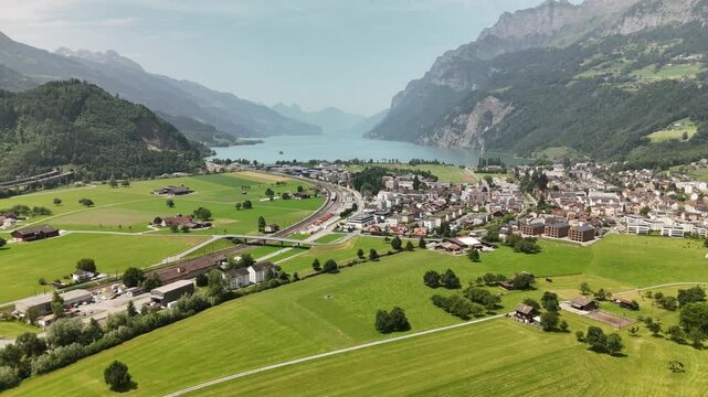 Scenic aerial view of rural countryside and Alpine mountain landscape near Flums, Berschis and Walenstadt on Lake Walensee, in the canton of St. Gallen, Switzerland &ndash; drone footage