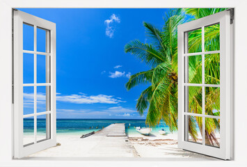 Window with a view of the ocean and a beach