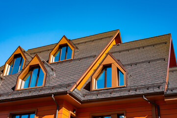 House with a slanted roof and two windows
