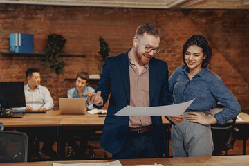 Skilled professionals collaborate in an innovative office, discussing strategies for future projects