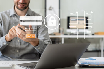 Businessman typing login and password in the concept of cyber security, information security, data...