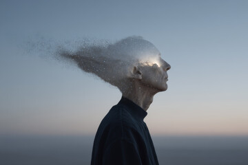 Alzheimer's disease concept art - decaying brain merging with fading human silhouette in monochrome