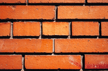 Brown brick with cement against the background of the wall. Modern construction. Old building in...