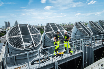 Professional engineer team service checking HVAC cooling tower, fan water Industry air conditioner