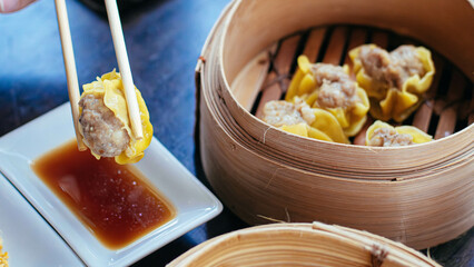 Golden Steamed Siu Mai Dumplings Served With Chopsticks