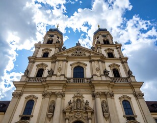 Fototapeta premium Ornate church facade under a partly cloudy sky