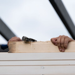 Installing boards in grooves when installing a wall in a gazebo.
