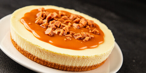 Cheesecake salted caramel sweet dessert fresh delicious gourmet food background on the table rustic food top view copy space