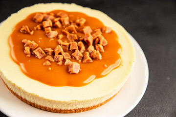 Cheesecake salted caramel sweet dessert fresh delicious gourmet food background on the table rustic food top view copy space