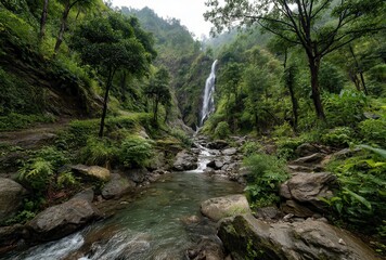 Serene Waterfall Amidst Lush Greenery and Rocky Riverbed in the Heart of Nature's Tranquil Landscape, Perfect for Peaceful Retreats and Outdoor Adventures