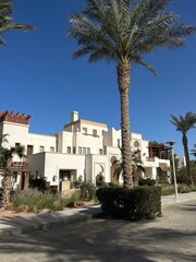 El Gouna, Egypt - April 5, 2025: A walk through the Egyptian Venice on a sunny spring day, located on small islands connected by bridges and canals along which boats ply.
