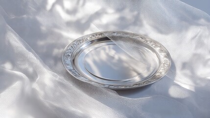 Elegant silver tray on sheer white fabric for product photography and luxury lifestyle stock images and backgrounds