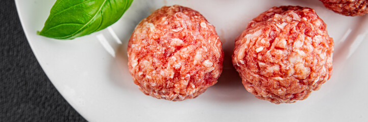 Meatballs raw meat pork, beef, chicken fresh delicious gourmet food background on the table rustic...
