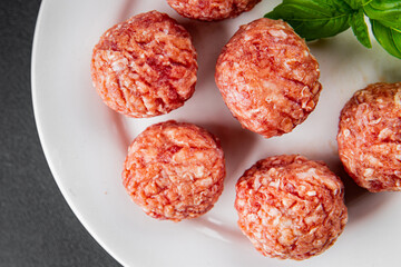 Meatballs raw meat pork, beef, chicken fresh delicious gourmet food background on the table rustic food top view copy space