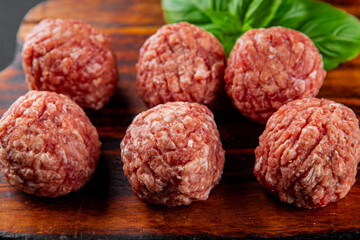 Meatballs raw meat pork, beef, chicken fresh delicious gourmet food background on the table rustic...