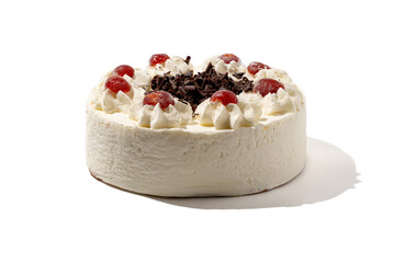 Classiccake topped with whipped cream, cherries, and chocolate shavings sits isolated on a white background. Its texture and decoration make it look delicious and festive.