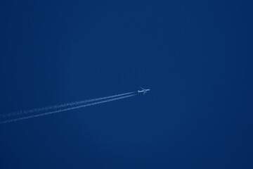 Airplane flying in the blue sky. Airplane in the blue sky.