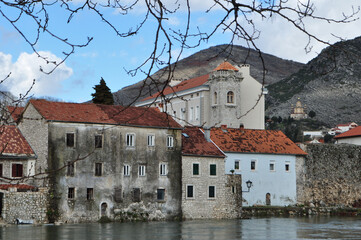 Historical buildings on the riverside in Trebinje, Bosnia and Herzegovina. Stone houses by the...
