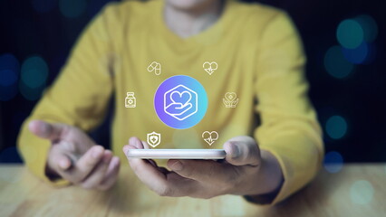 A user engages with a digital interface featuring health-related icons and symbols, highlighting the role of modern technology in medical care, diagnostics, and virtual health monitoring.