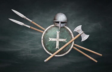 viking helmet axe shield and two spears on grunge background