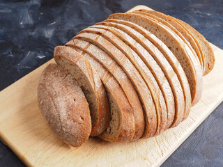 Tasty organic rye bread on a wooden cutting board