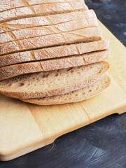 Tasty organic rye bread on a wooden cutting board