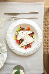 Portion of greek salad with fresh vegetables