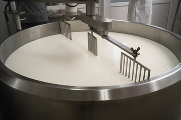 Traditional Cheese Making Process Stirring Fresh Milk in Industrial Stainless Steel Vat for Dairy Production