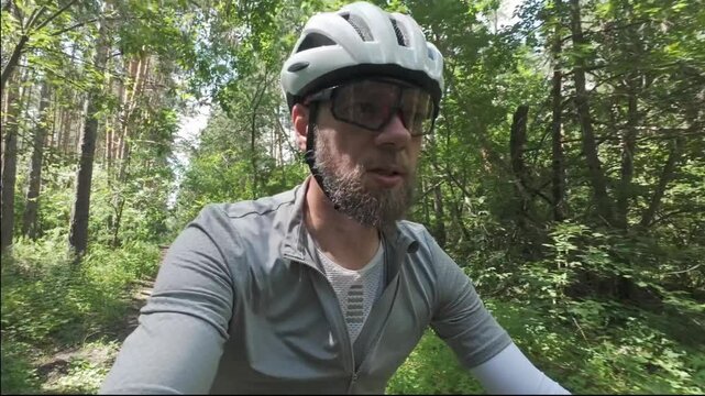 cycling in nature in wild places, bike-packing. A blogger makes a video for social media about his journey