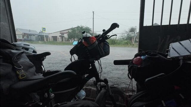cycling in nature in wild places, bike-packing. Riding in the forest in the rain
