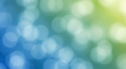 Obraz premium Abstract bokeh background with blue, green, and yellow blurred lights in a soft gradient