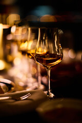 Luxury whiskey glasses in warm lighting