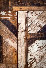 Wood background grunge texture highlighting the wooden grain. Natural rustic backdrop depicting a distressed surface comprising of slats of rough lumber, which is weathered, peeling, and rough.