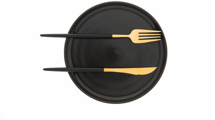 Black plate, gold cutlery, white backdrop