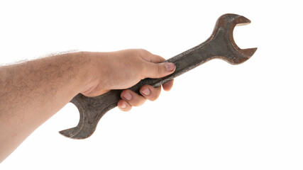 Hand holding a large adjustable wrench