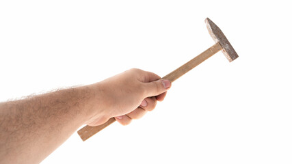 Hand holding a hammer ready for use