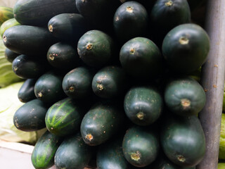 Cucumbers and cabbages together displayed for sale at a traditional Brazilian fair. Healthy food. Nutrition