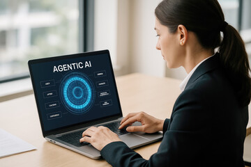Woman working on laptop with artificial intelligence interface technology office