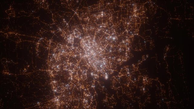 Turku (Finland) aerial view at night. Top view on modern city with street lights. Camera is zooming out, rotating clockwise. Vertical video. The north is on the left side