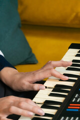 Fingers dancing over the keys of a vintage synthesizer, creating intricate melodies and rich...