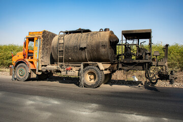 Indian Laborers Building Road Under Harsh Summer Sun Depicting Hardship and Resilience