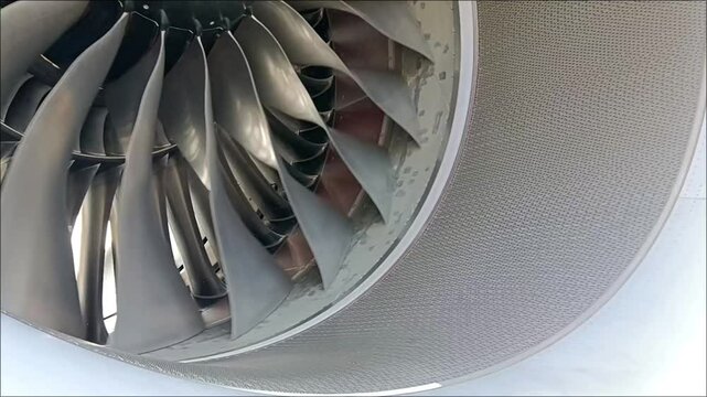 Close-up view of the fan blades of a Trent 7000 turbofan aircraft engine spinning in the wind
