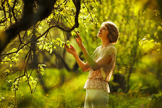 Beautiful woman in the summer garden.
