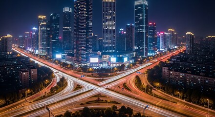 Night View of a Modern City Intersection with Bright Lights and Traffic Trails
